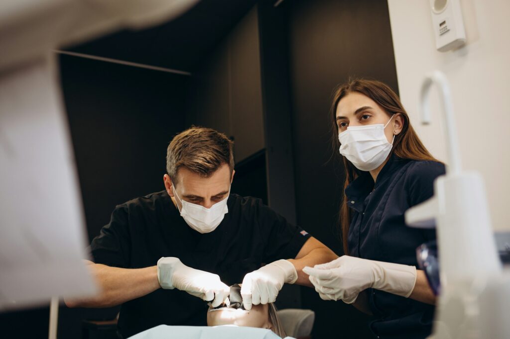 Dentist's appointment, the girl puts and removes braces from her teeth